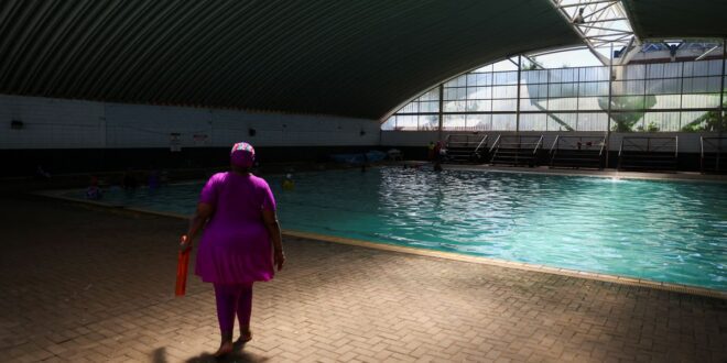Elderly South African women swim for fitness.