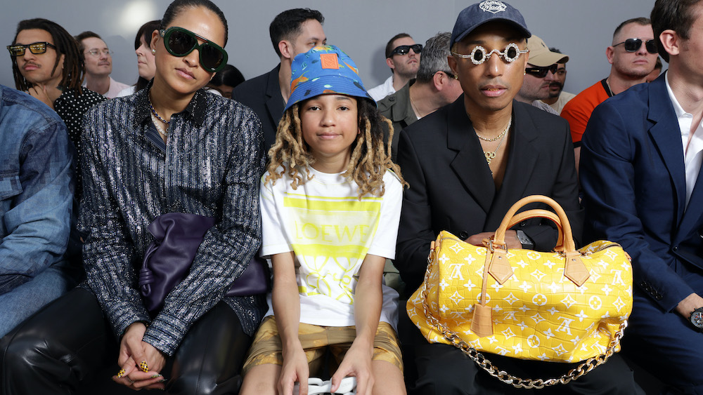 PARIS, FRANCE - JUNE 24: Helen Lasichanh, Rocket Williams and Pharrell Williams attend the Loewe Menswear Spring/Summer 2024 show as part of Paris Fashion Week on June 24, 2023 in Paris, France. (Photo by Pascal Le Segretain/Getty Images for Loewe)