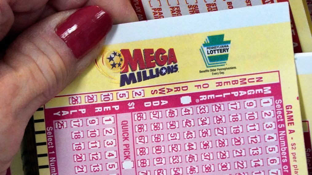 FILE - A Mega Millions wagering slip is held in Cranberry Township, Pa., Jan. 12, 2023. The Mega Millions jackpot has grown again, to at least an estimated $640 million, after there was no winner Friday night, July 14. (AP Photo/Gene J. Puskar, File)