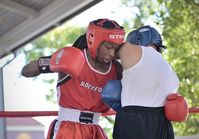 My'Aire King, 17, of Rockford Patriots Boxing Club, throws a punch at Ezequiel Ramos of Chicago CYBC during the Rockford Boxing Classic at the Rockford City Market pavilion on Saturday, Aug. 12, 2023. King won by a unanimous decision.