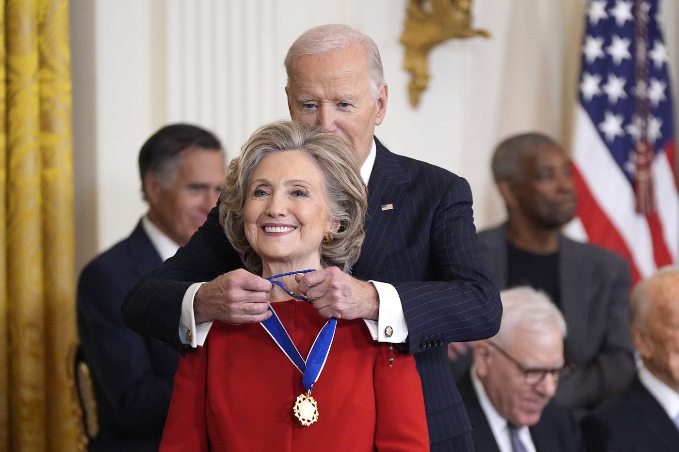 President Joe Biden, right, presents the Presidential Medal of Freedom, the Nation's highest civilian honor, to former Secretary of State Hillary Clinton, in the East Room of the White House, Saturday, Jan. 4, 2025, in Washington. (AP Photo/Manuel Balce Ceneta)